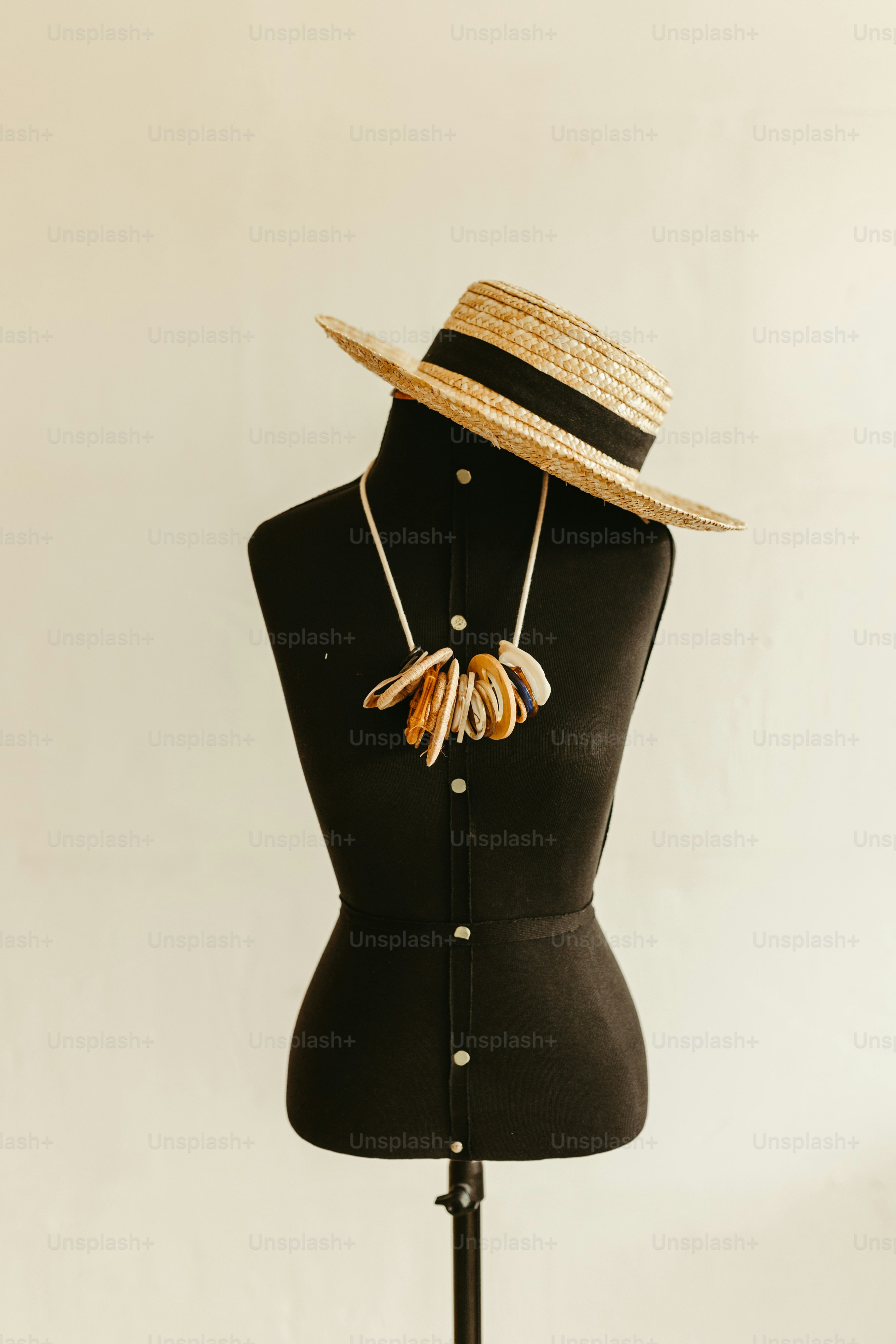 a mannequin wearing a hat with bananas on it