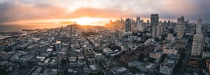 an aerial view of a city at sunset