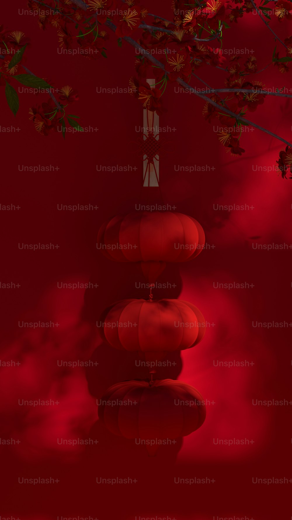 un fond rouge avec des lanternes rouges suspendues à un arbre