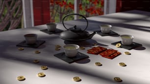 a table topped with cups and saucers filled with liquid