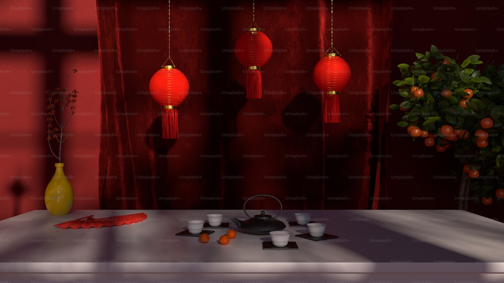 a room with a table and a vase with red lanterns hanging from it