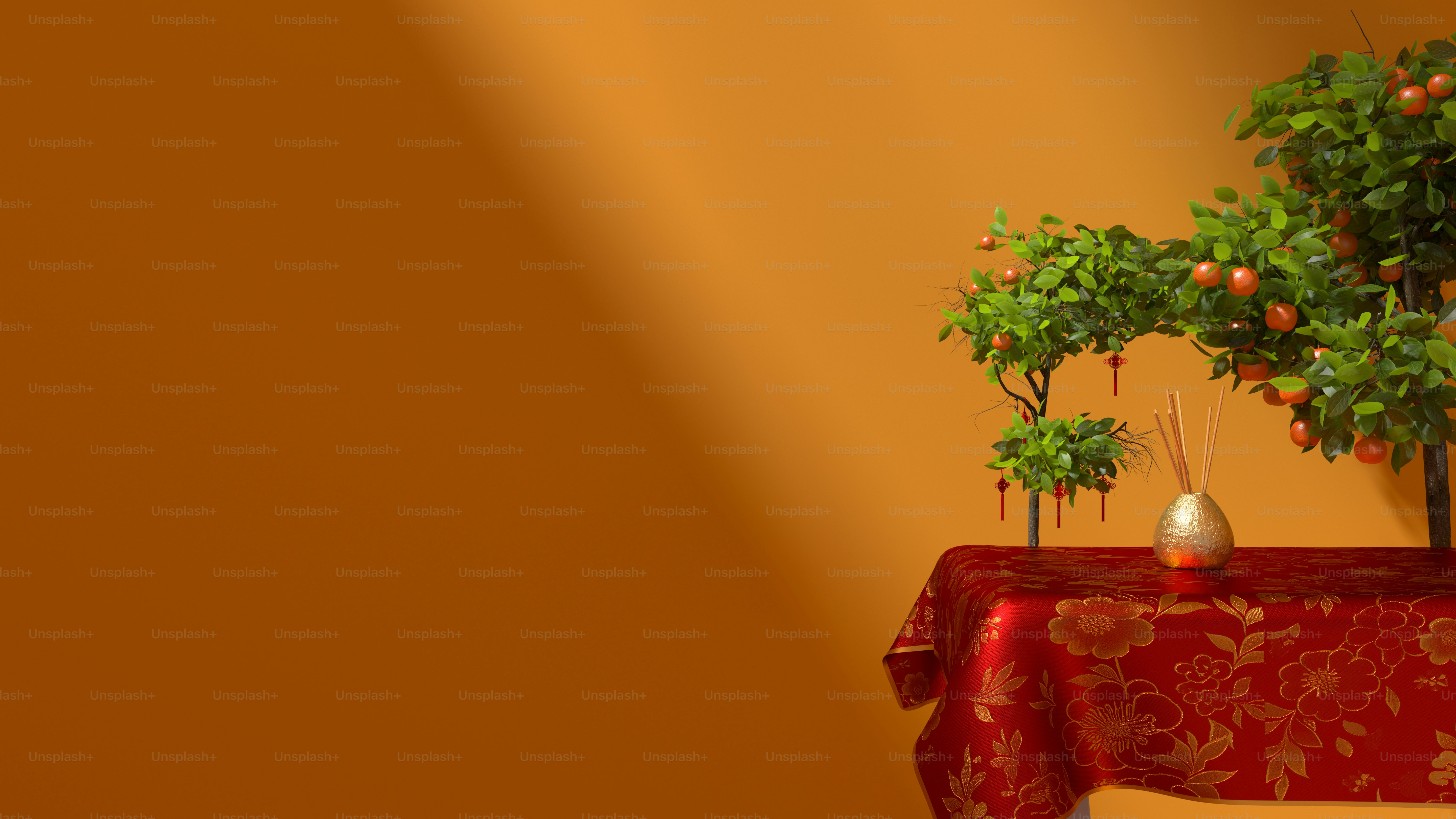 a table topped with a vase filled with oranges