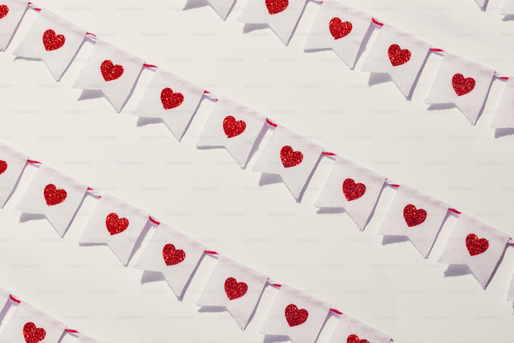 a white wall with red hearts on it