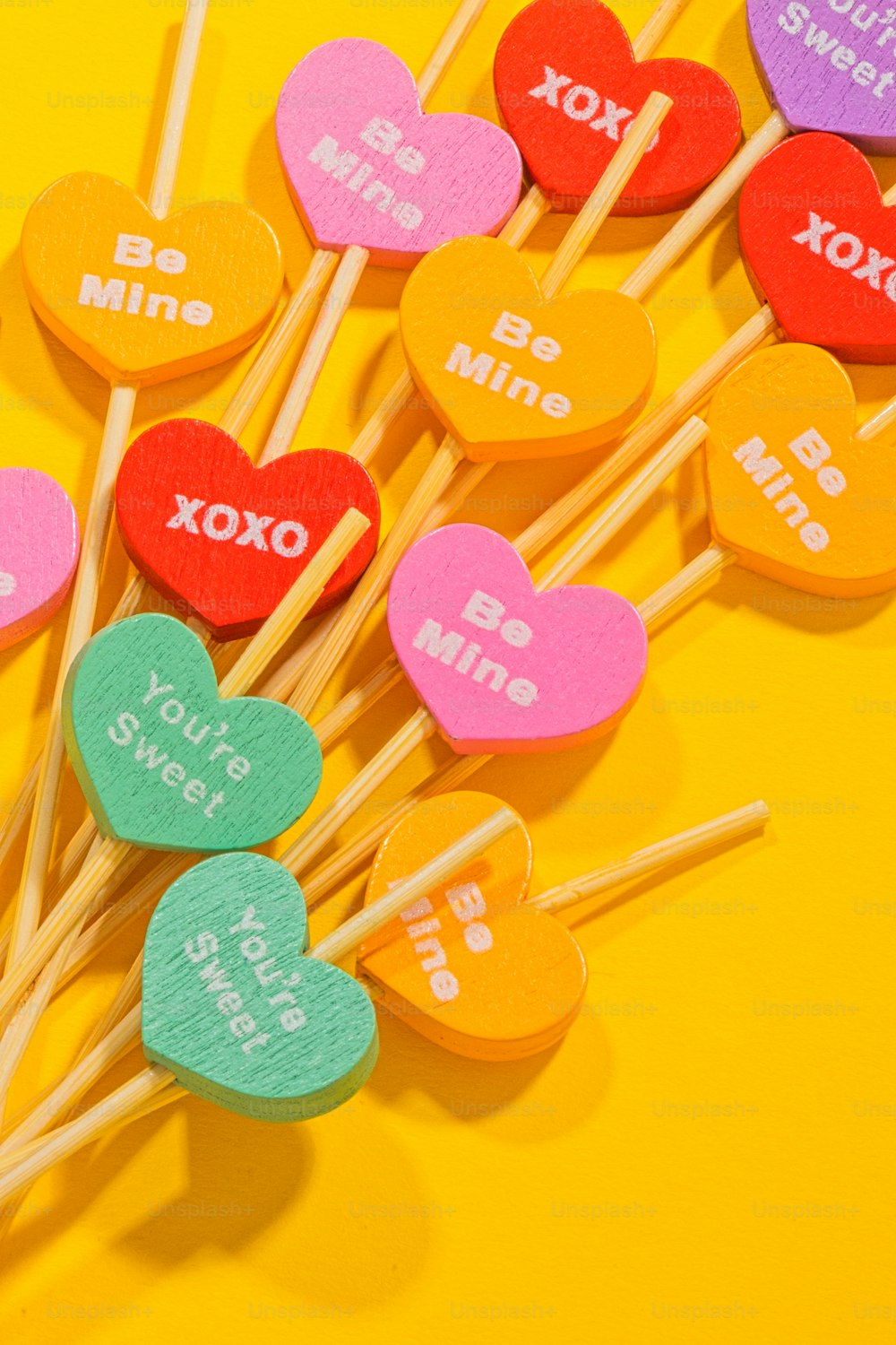 a bunch of lollipops that are shaped like hearts