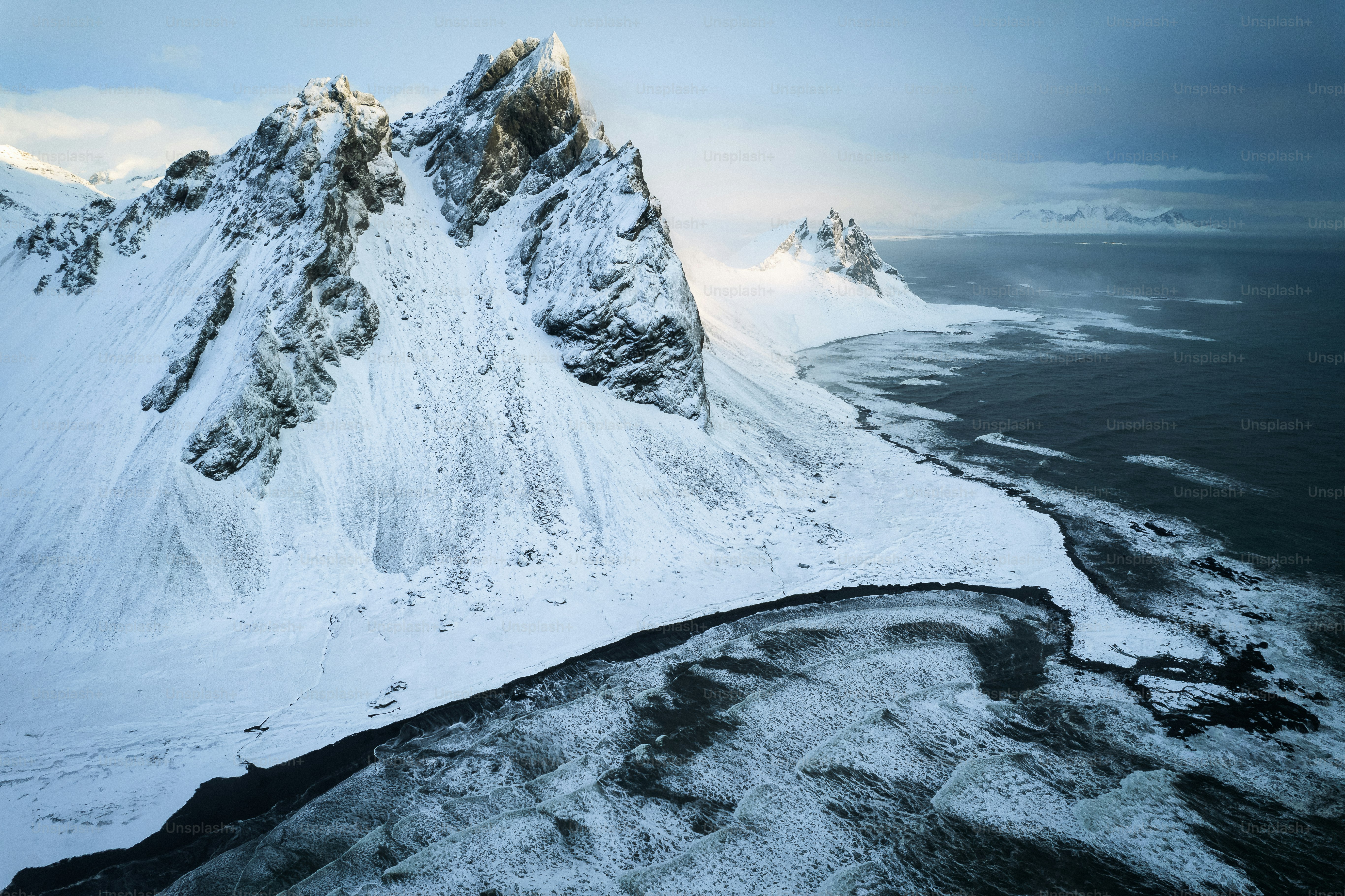 An aerial view of a snow covered mountain photo – Iceland Image on Unsplash