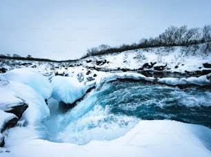 a frozen waterfall in the middle of a river