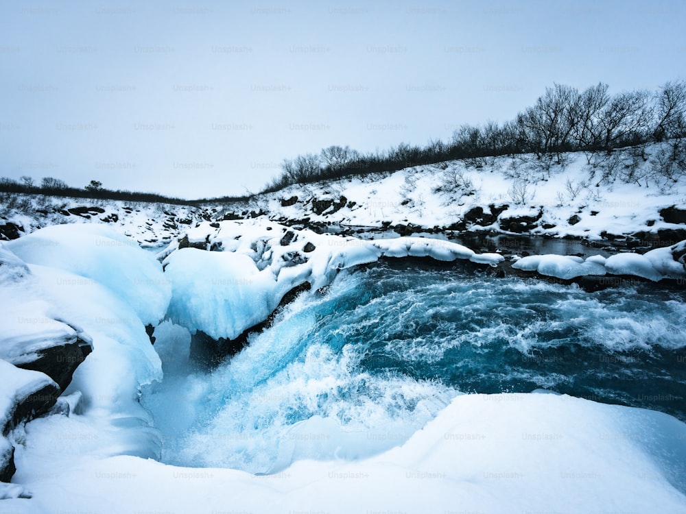 a frozen waterfall in the middle of a river