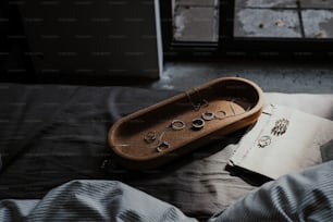 a book and a pair of eyeglasses on a bed