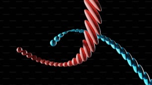 a red and blue spiral shaped object on a black background