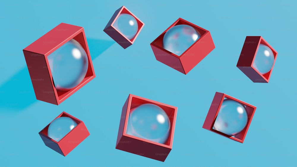 um grupo de caixas vermelhas sentadas em cima de uma superfície azul