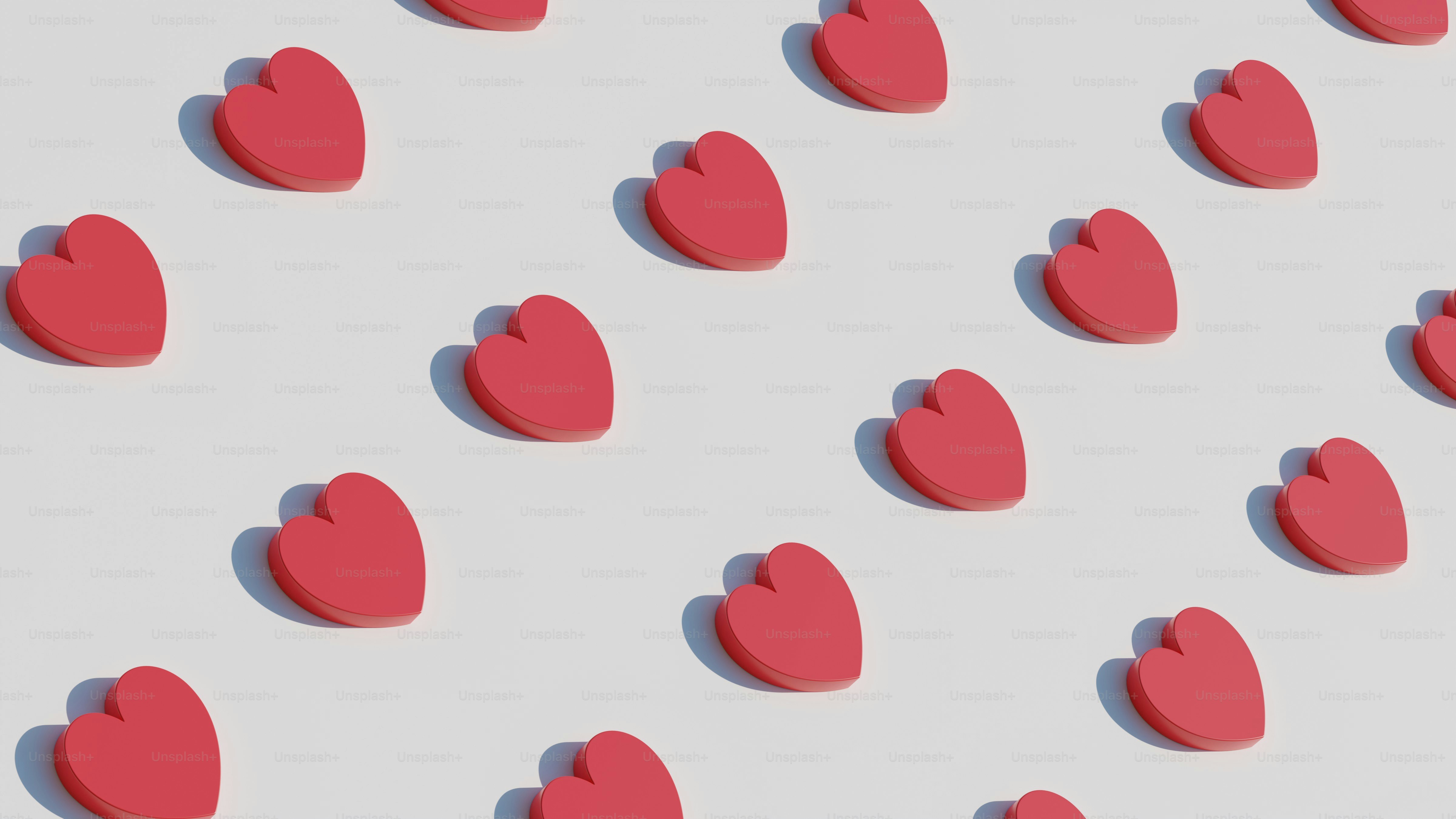 a group of red hearts on a white background