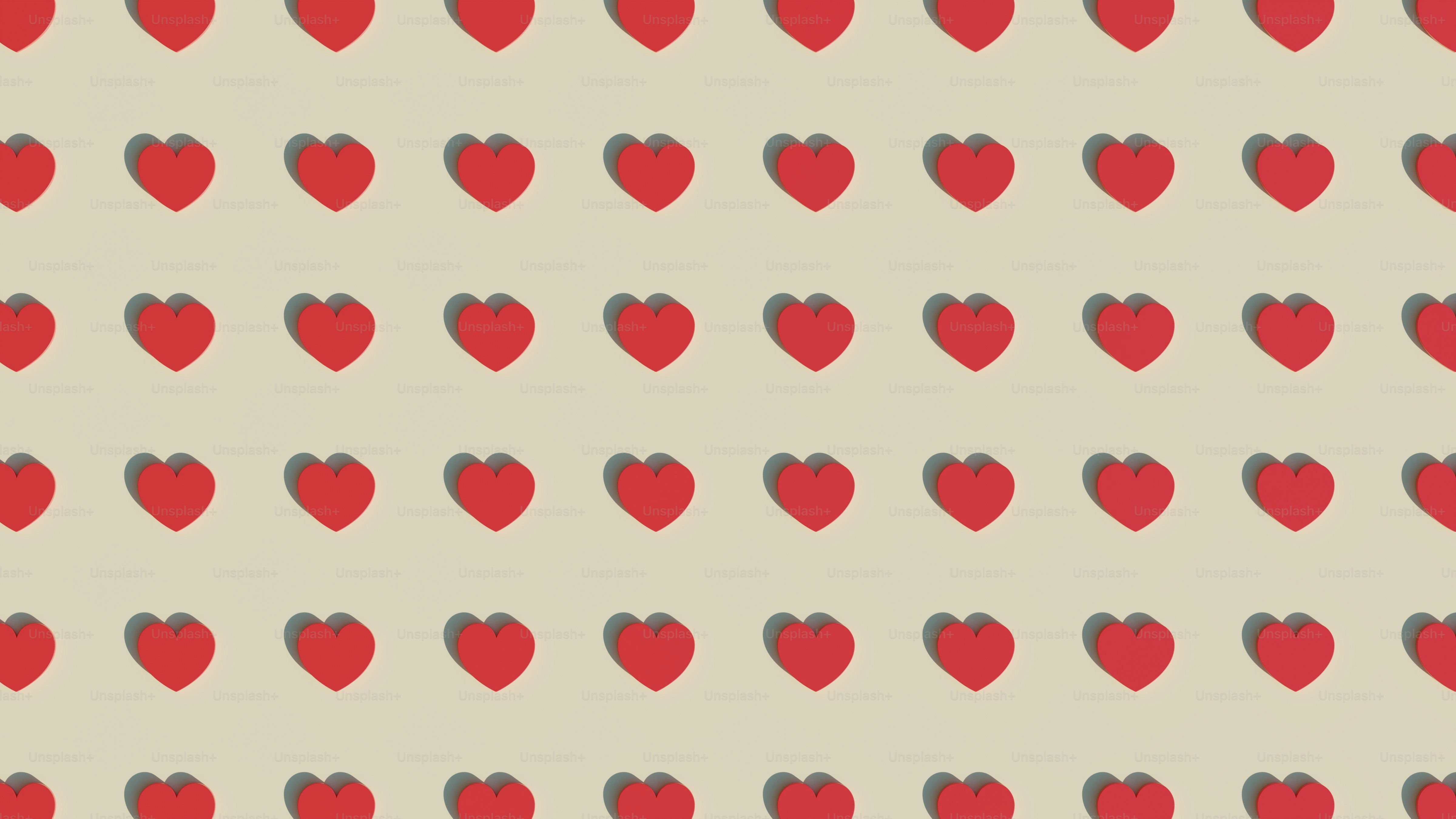 a group of red hearts on a white background