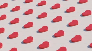 a group of red hearts sitting on top of a white surface