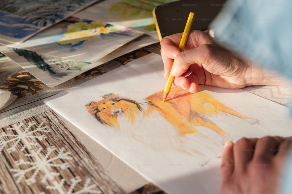 a person drawing a picture of a dog with a pencil