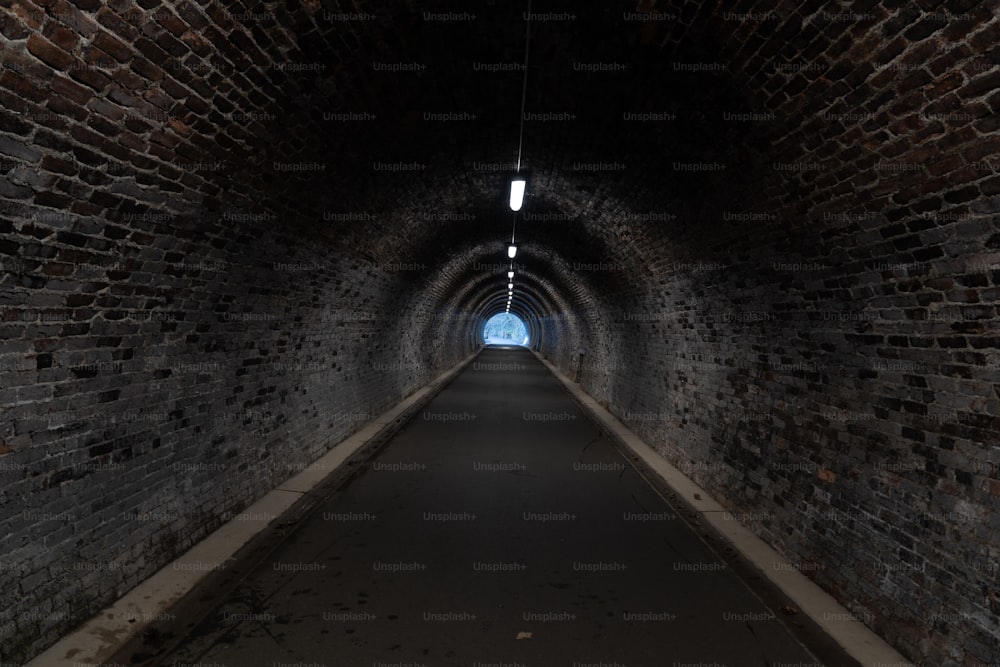 a dark tunnel with a light at the end