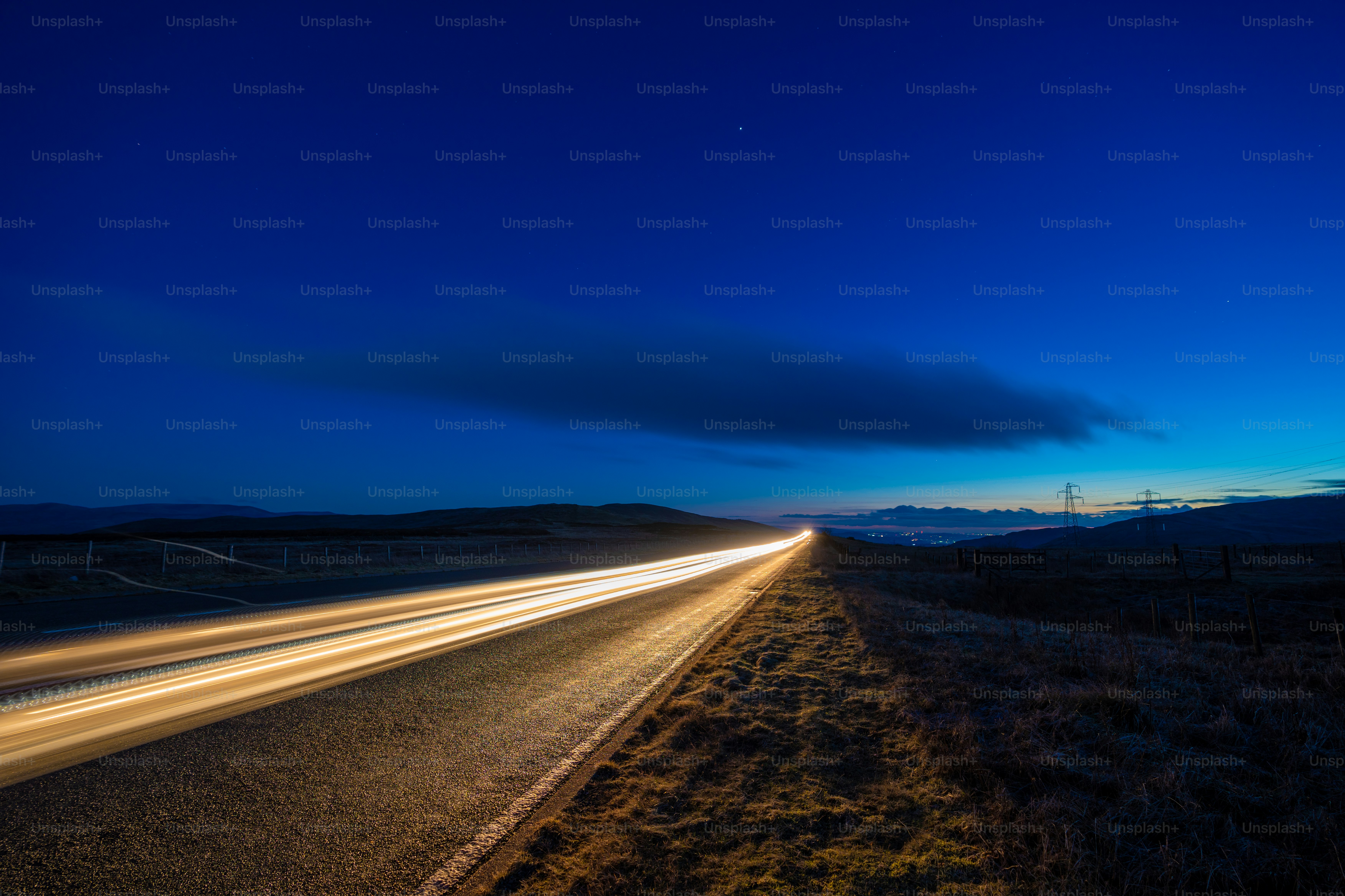 a long exposure shot of a highway at night