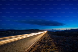 a long exposure shot of a highway at night