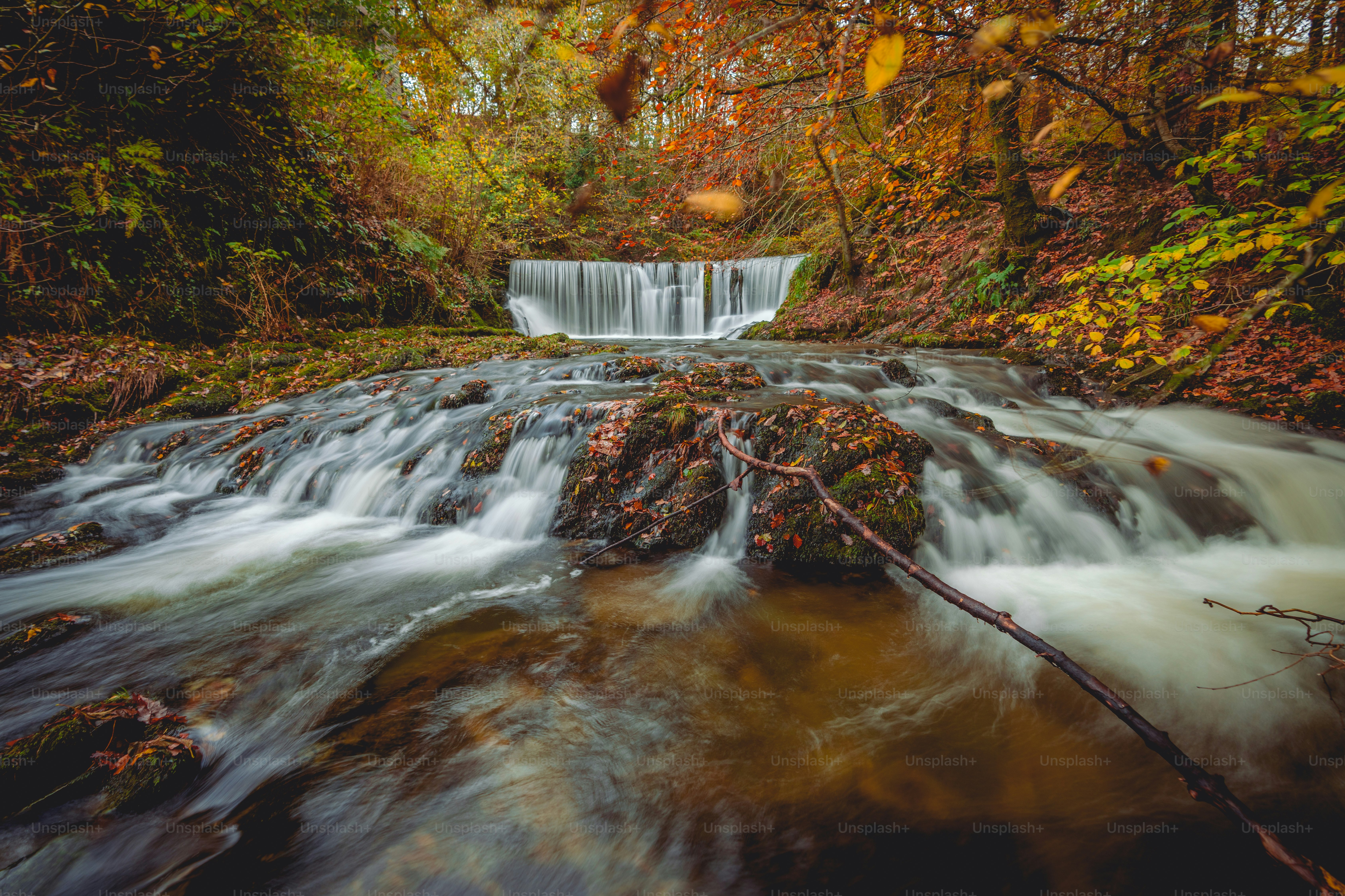 A beautiful autumn waterfall is a perfect place for healing mind, body and soul