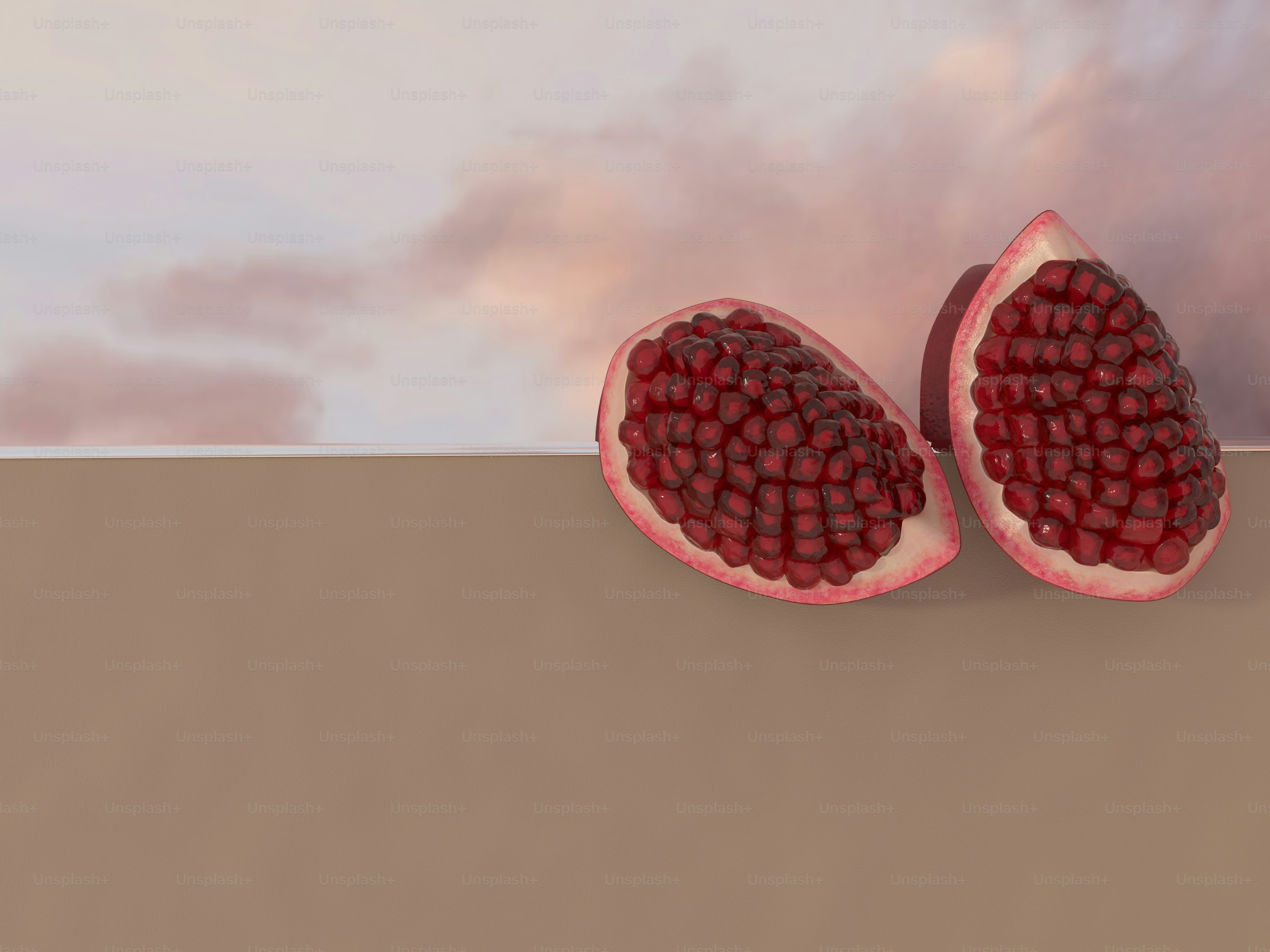 two halves of a pomegranate on a brown surface