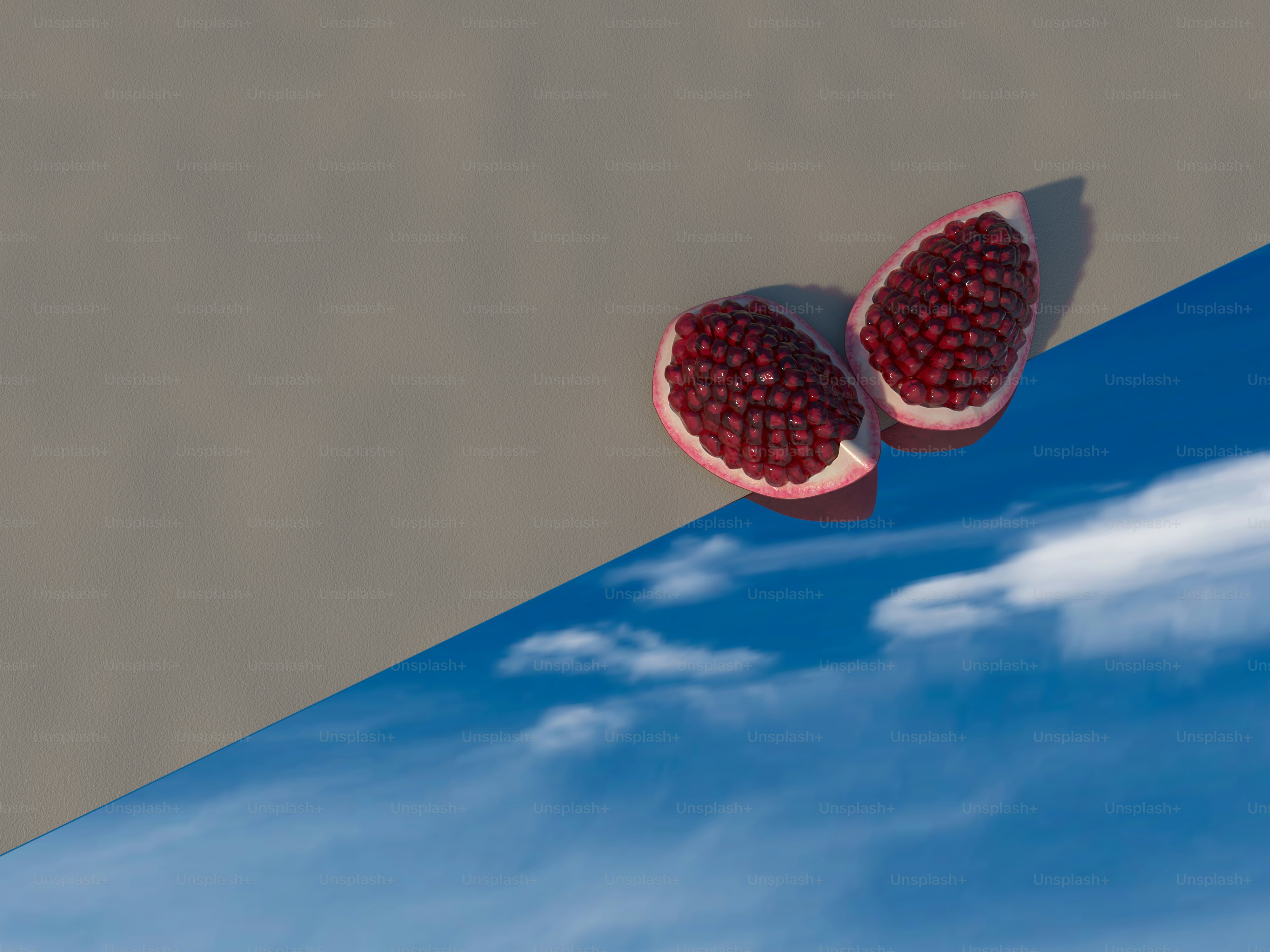 a pair of pomegranates sitting on top of a table