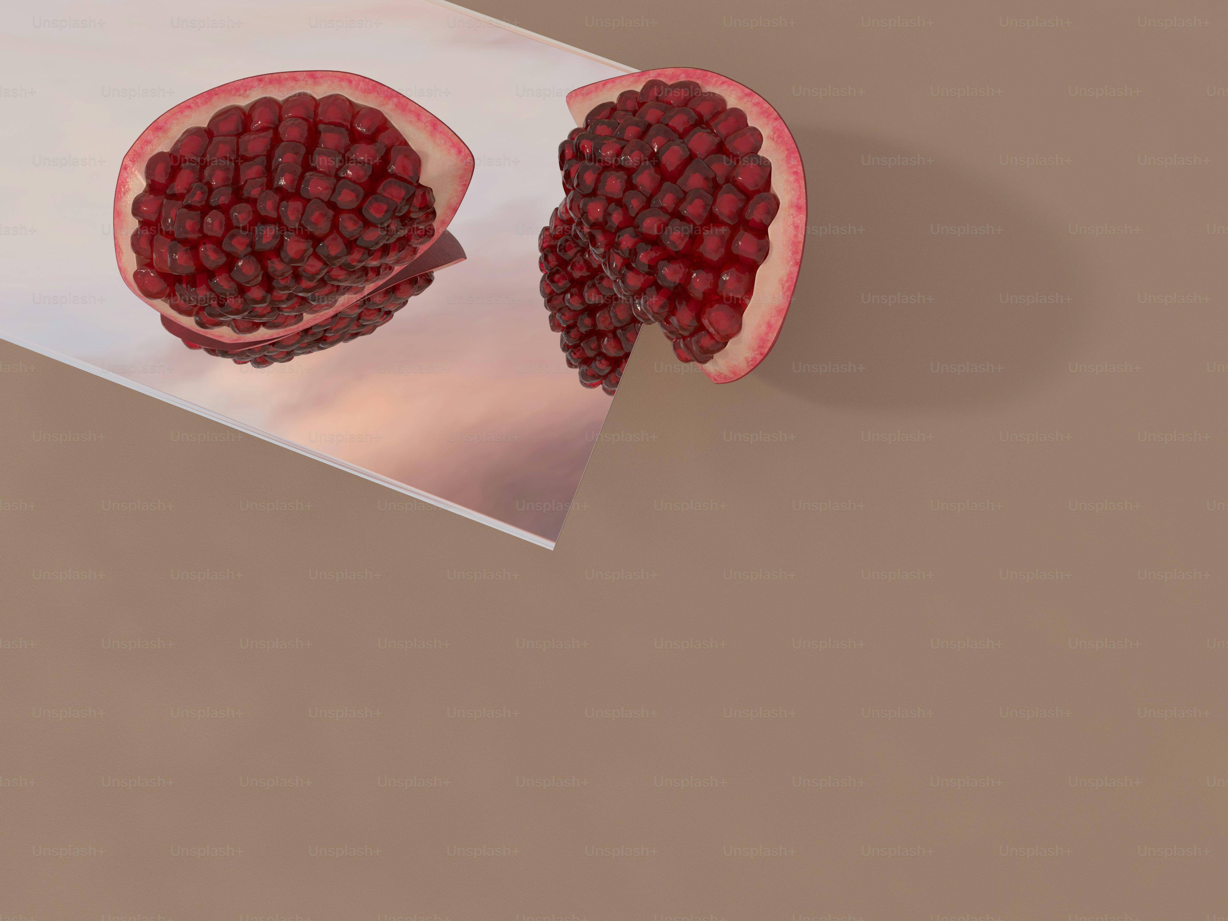 a pomegranate cut in half on a table