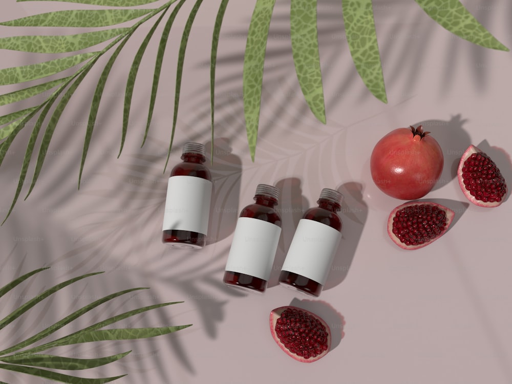 three bottles of pomegranate sit next to a half - ripe pome