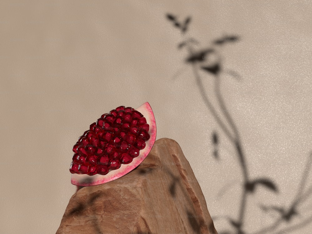 a pomegranate sitting on top of a piece of wood
