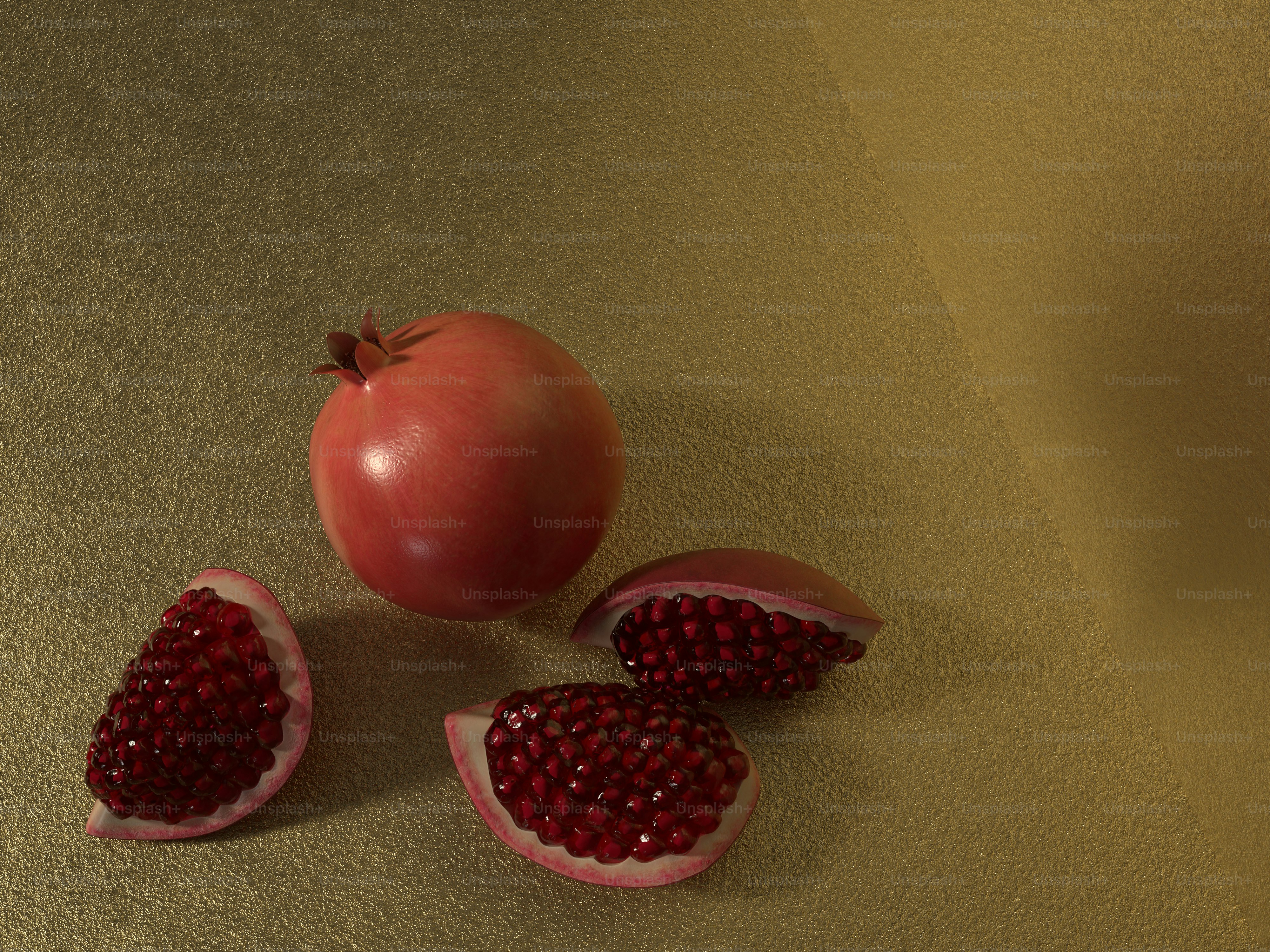 a pomegranate and a whole pomegranate on a table