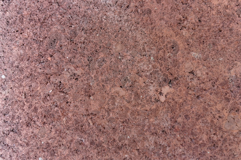 a close up of a red granite surface