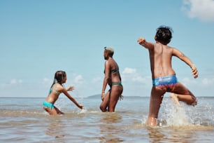 a group of people playing in the water