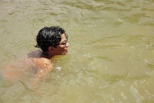 a man swimming in a body of water