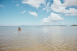 a couple of people in a body of water