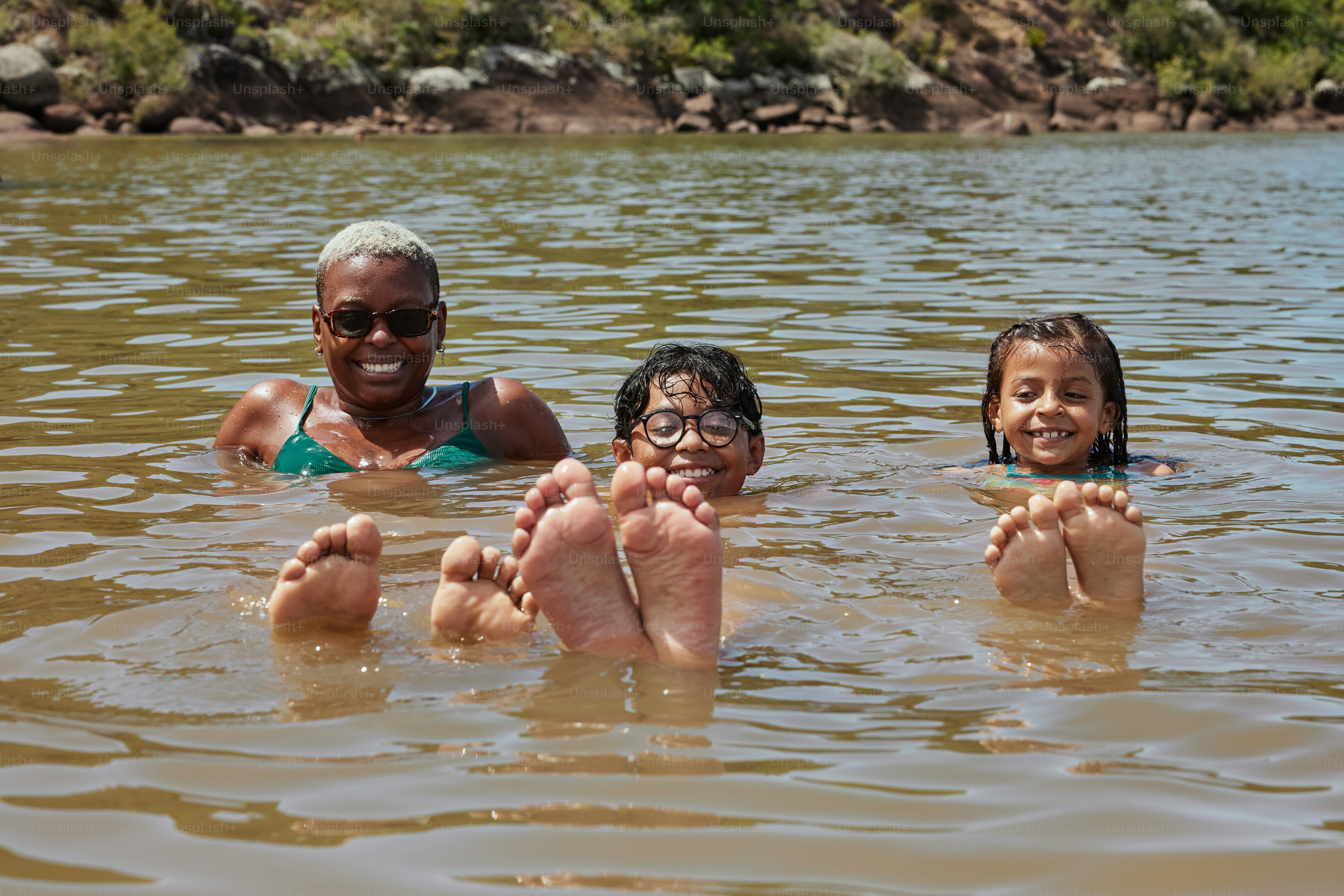 a group of people floating on top of a body of water