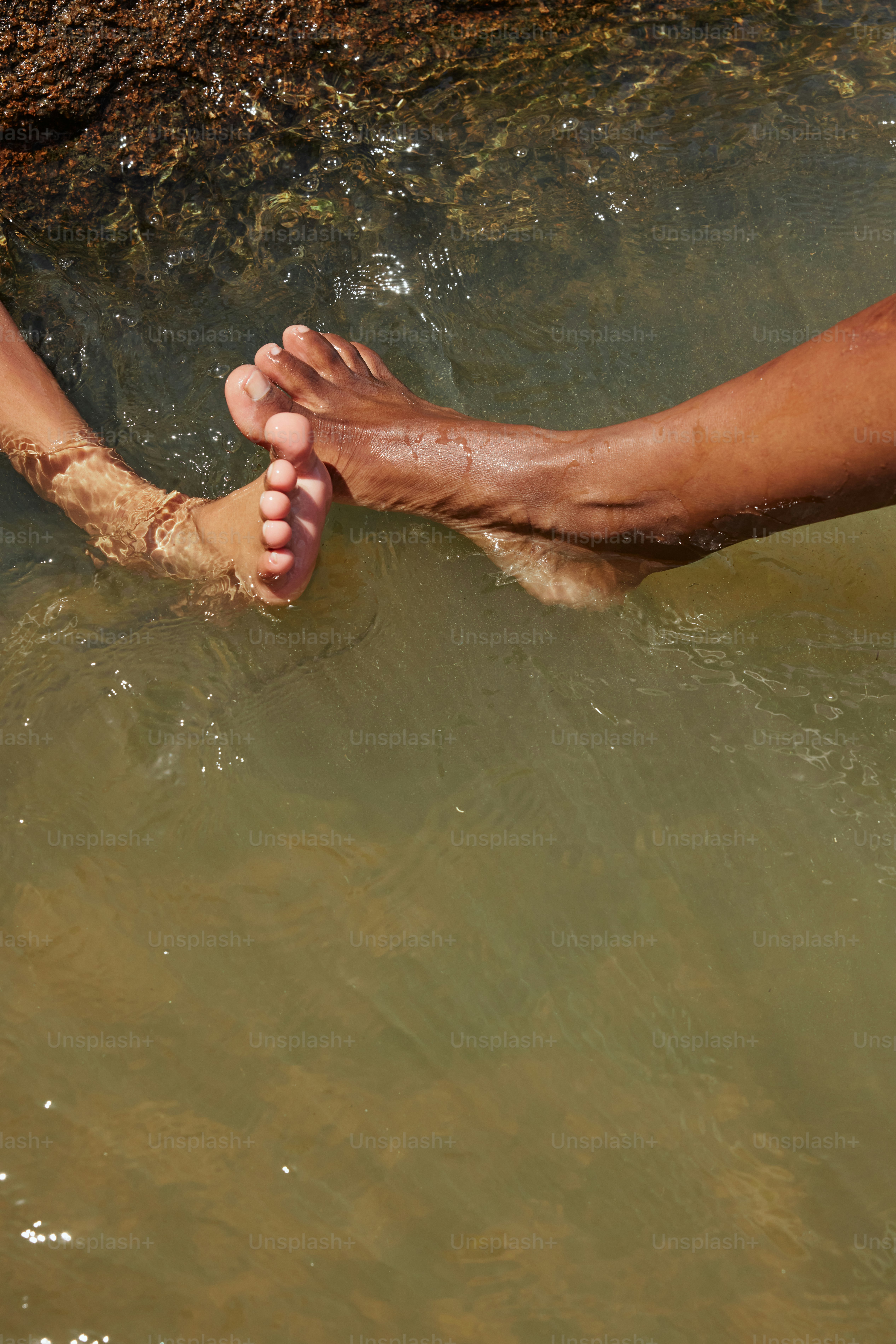 a person with their feet in the water