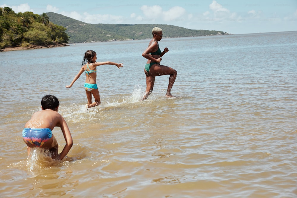 a group of children playing in the water