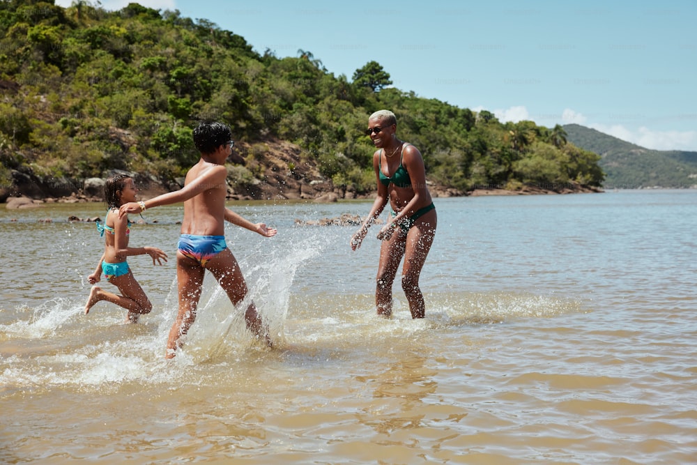 a group of people playing in a body of water