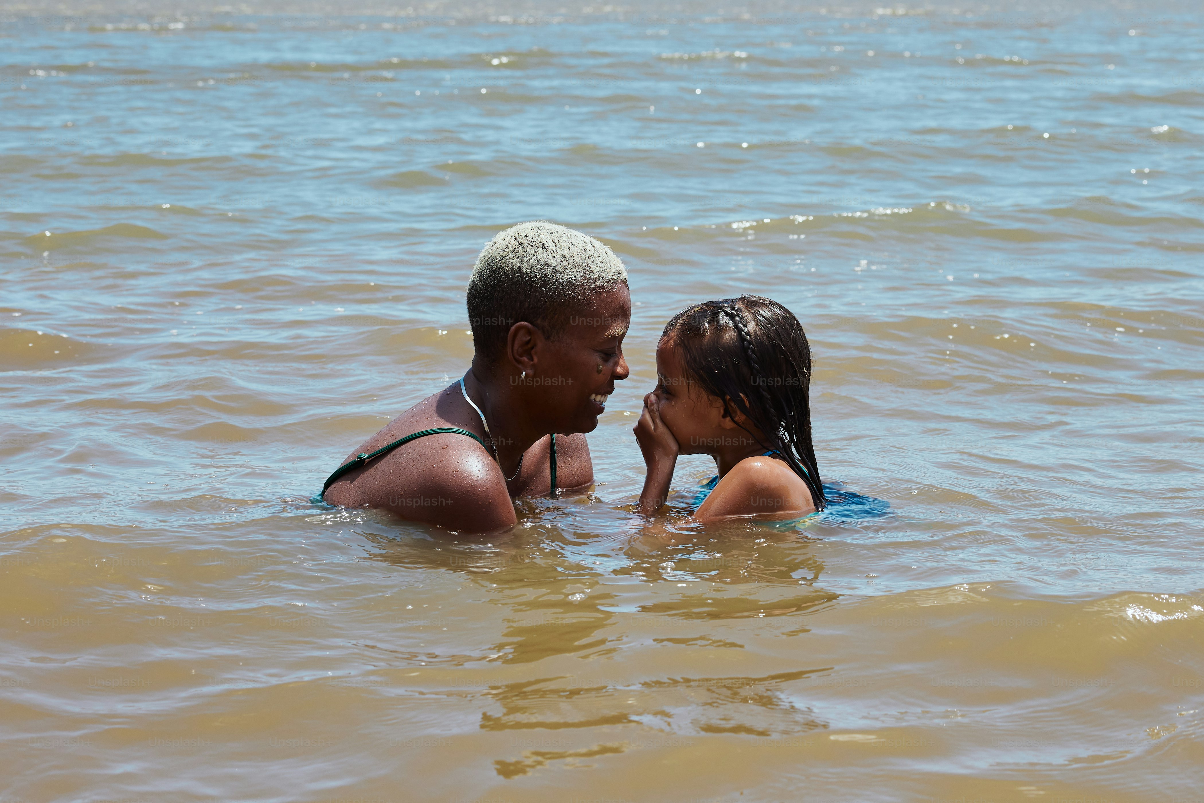 a couple of people that are in the water