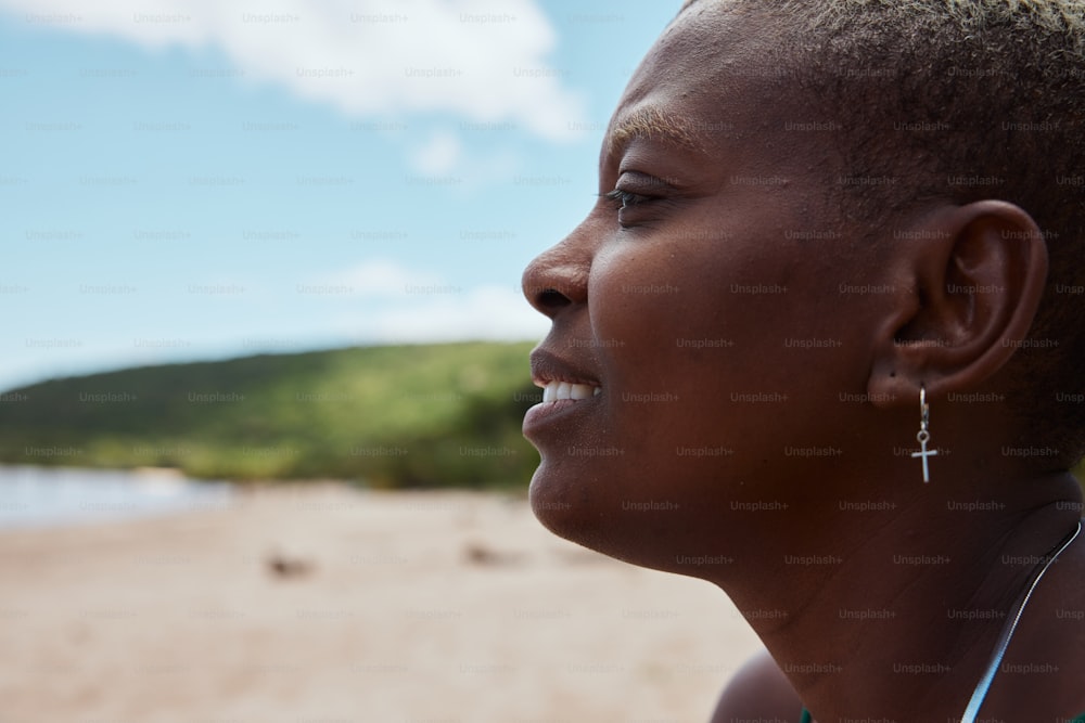 a close up of a person with a sky background