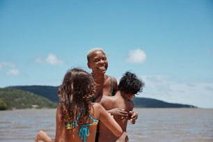 a group of people that are standing in the water