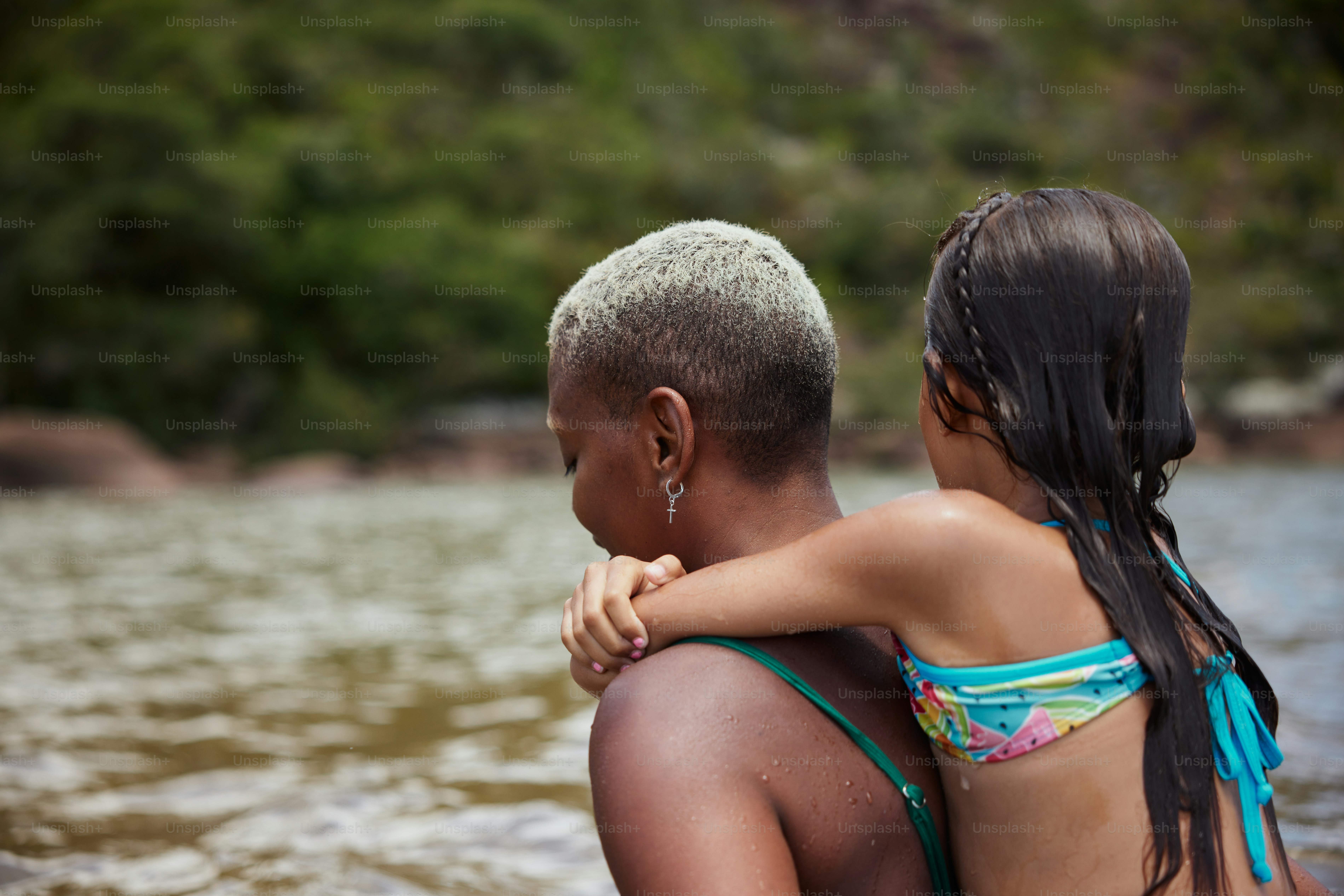 a couple of people that are standing in the water