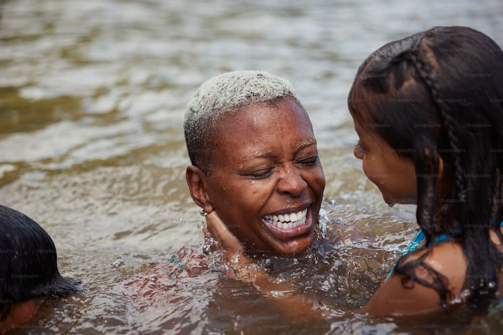 a woman and a child are in the water