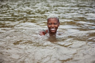 a man swimming in a body of water