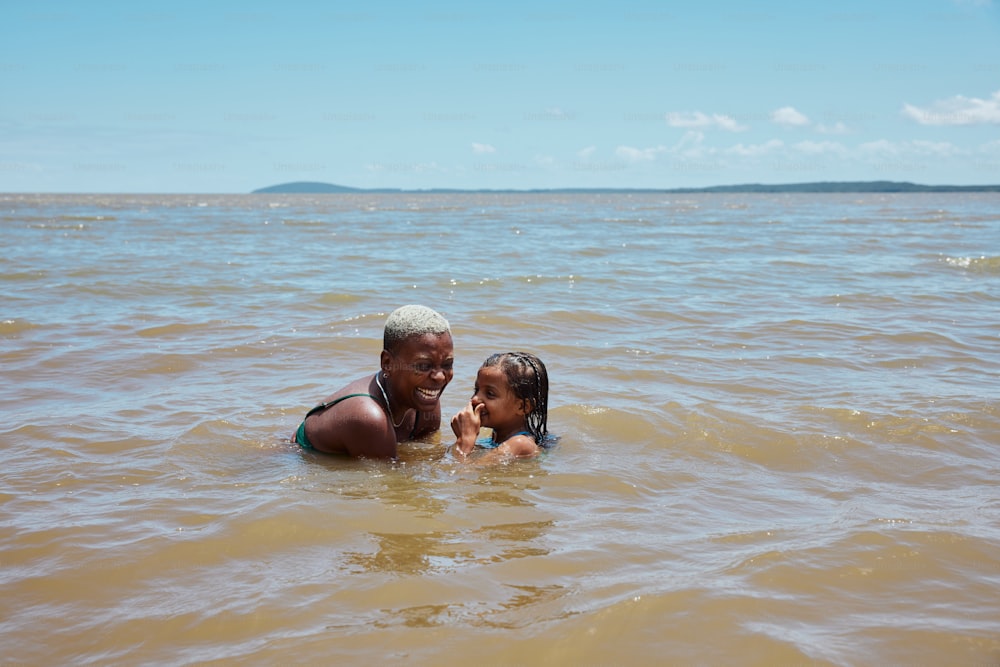 a couple of people that are in the water