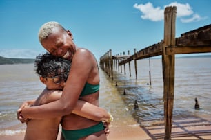 a couple of people that are standing in the water