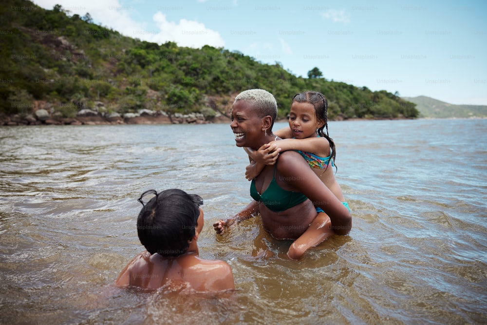 a woman and a child are in the water