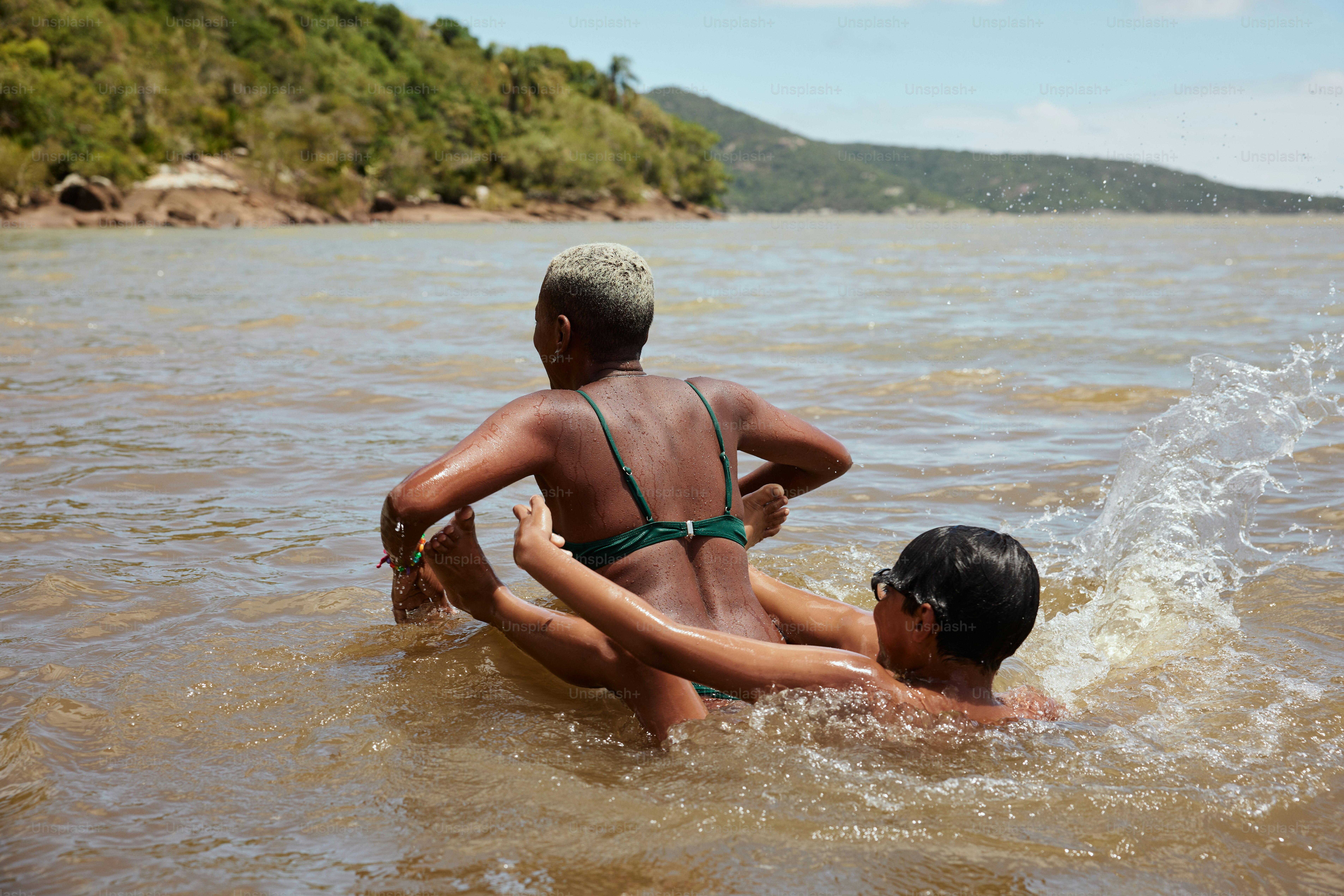 a couple of people that are in the water