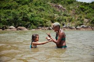 a man and a little girl in the water