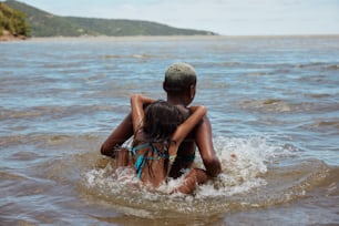 a couple of people that are in the water