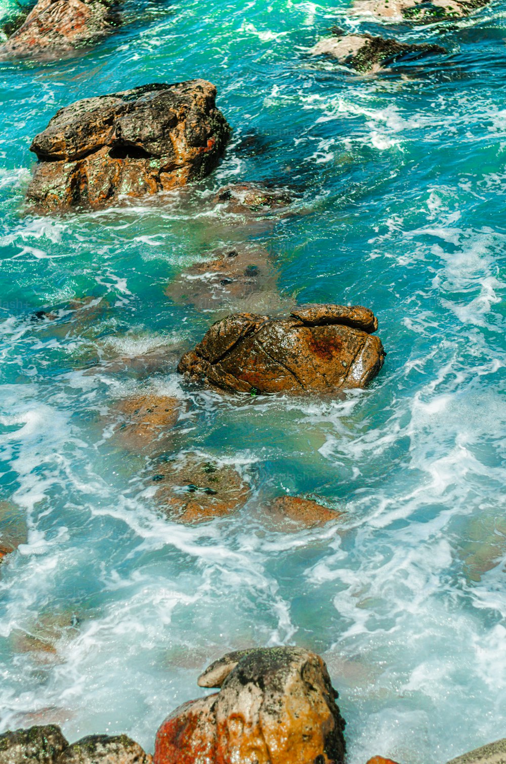 a couple of rocks that are in the water