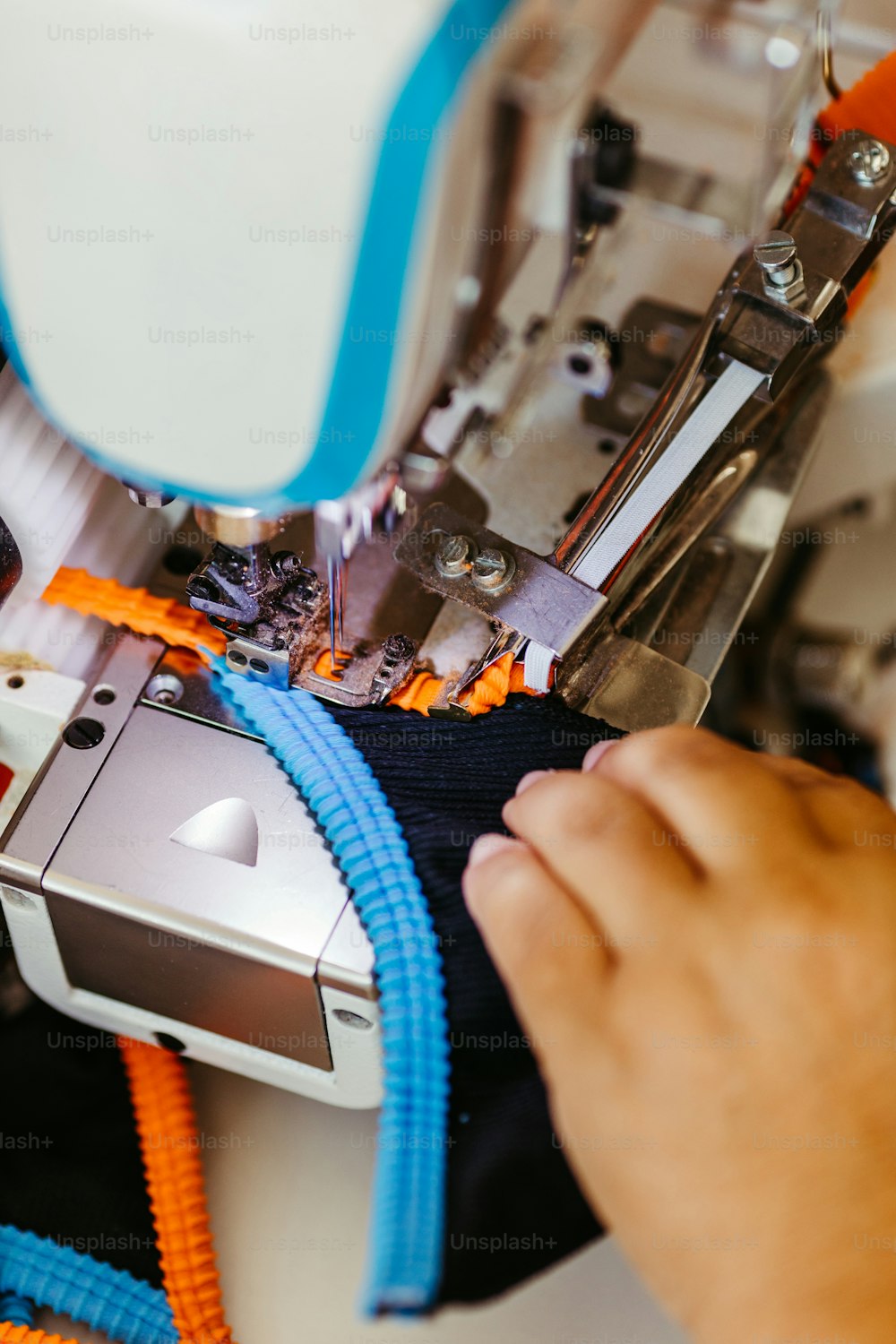 a person working on a sewing machine